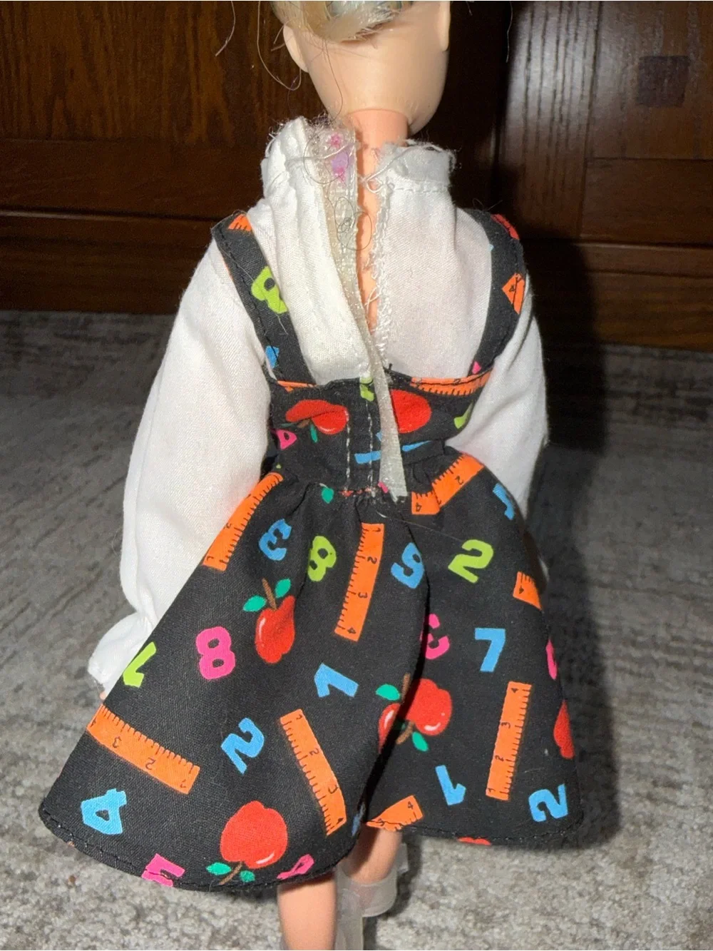 vintage 1995 Mattel Teacher Barbie doll outfit, featuring a black jumper dress